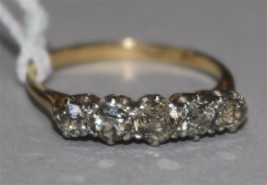 A gold and platinum five stone diamond half hoop ring, size P.